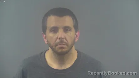 Mugshot of JOSHUA TYLER ESCUE booked in Warren County, Kentucky on March 12, 2026