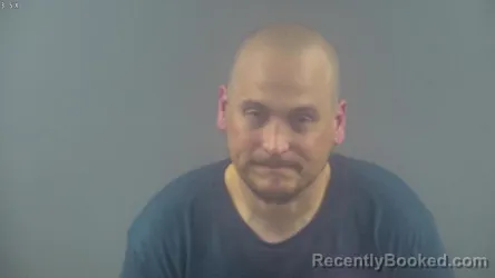 Mugshot of JUSTIN DYLAN MOLDERO booked in Warren County, Kentucky on May 13, 2026