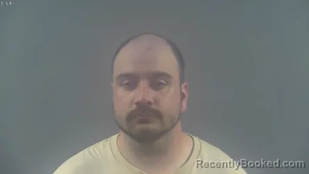 Mugshot of TRAVIS JAROD HOLTZCLAW booked in Warren County, Kentucky on April 6, 2026