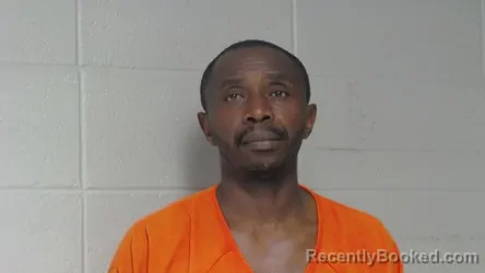 Mugshot of CHARLES NJI booked in Woodford County, Kentucky on April 19, 2026