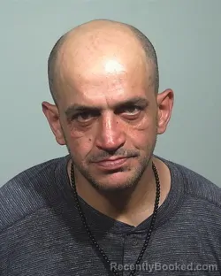 Mugshot of Ali Khalid Hassan booked in Cumberland County, Maine on July 3, 2026