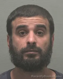 Mugshot of GAIS ALI HIZAM booked in New Hanover County, North Carolina on March 13, 2026