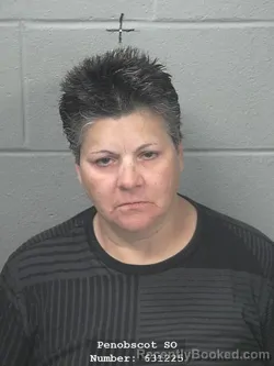 Mugshot of Nelia C Oliveira booked in Penobscot County, Maine on October 9, 2026
