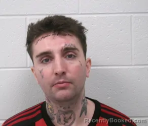 Mugshot of JUSTIN MICHAEL DEMOSS