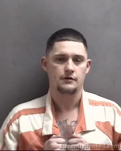 Mugshot of JUSTIN BROOKS HAYES