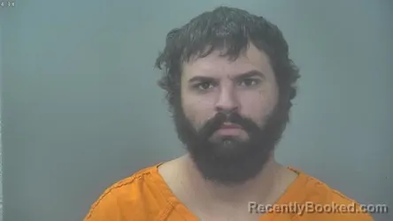 Mugshot of Travis Michael Johnson booked in Alpena County, Michigan on October 19, 2026