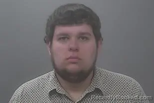 Mugshot of TRAVIS JON WENZEL booked in Alpena County, Michigan on April 6, 2026