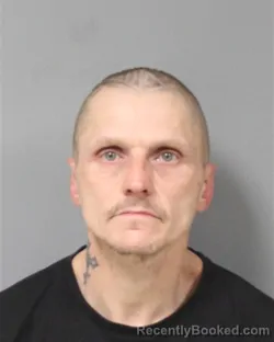 Mugshot of JASON RAY HETTINGER booked in Berrien County, Michigan on April 9, 2026