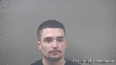 Mugshot of CARSYN JAMES MOORE booked in Dickinson County, Michigan on March 26, 2026