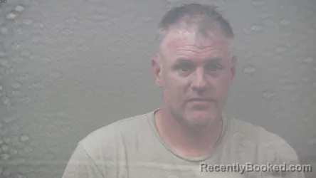 Mugshot of Justin Robert Cook booked in Dickinson County, Michigan on August 20, 2026