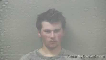 Mugshot of Tanner Jay Miller booked in Dickinson County, Michigan on August 22, 2026