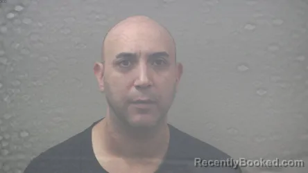 Mugshot of Daniel Edward Baumann booked in Dickinson County, Michigan on October 22, 2026