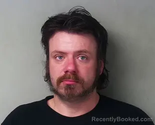 Mugshot of Travis J Simpkins