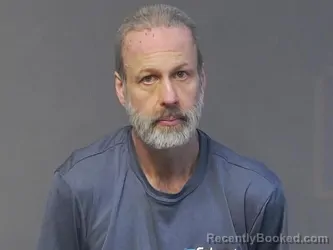 Mugshot of DENNIS JAMES DOBES booked in Houghton County, Michigan on March 30, 2026