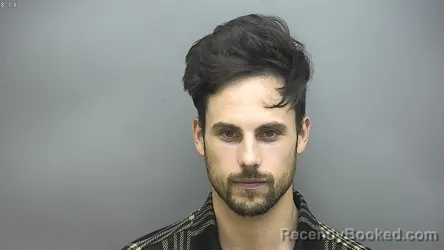 Mugshot of Justin Davis Bora booked in Isabella County, Michigan on August 27, 2026