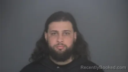 Mugshot of HASSAN AL-KUFI booked in Lapeer County, Michigan on March 27, 2026