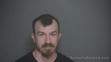 Mugshot of Austin Kuester booked in Lapeer County, Michigan on August 21, 2026