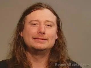 Mugshot of Bennett Earl Woltz booked in Marquette County, Michigan on April 1, 2026