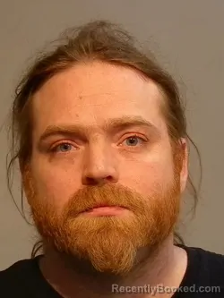 Mugshot of Dane Ronald-Richard Brickey booked in Marquette County, Michigan on April 20, 2026