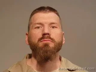 Mugshot of Justin Andrew Sarnowski booked in Marquette County, Michigan on June 1, 2026