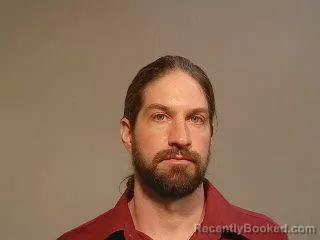 Mugshot of Jeremy Michael Hibbard booked in Marquette County, Michigan on June 12, 2026