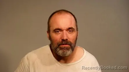 Mugshot of Douglas Allan Cooper booked in Marquette County, Michigan on August 26, 2026