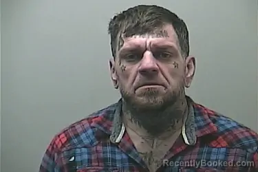 Mugshot of JEREMY ALLEN BREWSTER