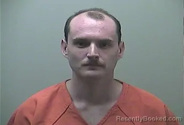 Mugshot of Justin Tyme Michalak booked in Midland County, Michigan on October 9, 2026