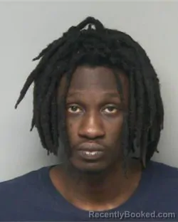 Mugshot of JOHN POUL BASONDOLE