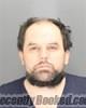 Booking photo from Oakland County, Michigan