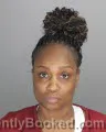 Mugshot of APRIL TANISHA WARREN booked in Oakland County, Michigan on April 2, 2026