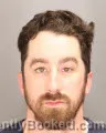 Mugshot of NATHAN AARON STAMM booked in Oakland County, Michigan on April 25, 2026