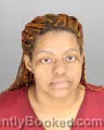 Mugshot of DENIA RE MOSS-BOOKER booked in Oakland County, Michigan on April 28, 2026