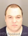 Mugshot of JOSHUA BRYAN OLKOWSKI booked in Oakland County, Michigan on May 18, 2026