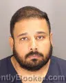 Mugshot of DHANANJAY MISHRA booked in Oakland County, Michigan on May 24, 2026