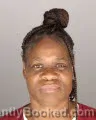 Mugshot of SYLINA LACITRA BENTON booked in Oakland County, Michigan on July 1, 2026