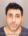 Mugshot of MANHAL NAJIB booked in Oakland County, Michigan on July 2, 2026
