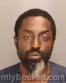 Mugshot of SHAMS ADESHINA AIGORO booked in Oakland County, Michigan on July 7, 2026