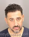 Mugshot of MOHAMAD HASSAN NASSER booked in Oakland County, Michigan on July 8, 2026
