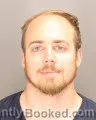 Mugshot of TRAVIS FRANKLIN MINOGUE booked in Oakland County, Michigan on July 14, 2026