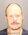 Mugshot of Leonard John Harris booked in Oakland County, Michigan on August 26, 2026