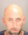 Mugshot of Nathan Thomas Tomanek booked in Oakland County, Michigan on September 2, 2026