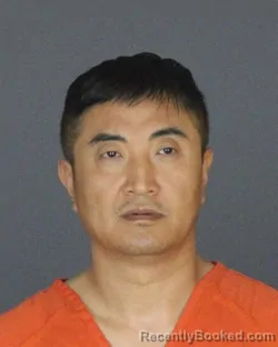 Mugshot of Zhelong Jin booked in St Clair County, Michigan on July 25, 2026