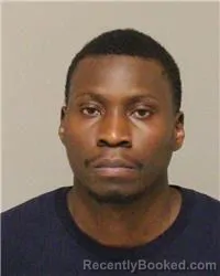 Mugshot of WILLIAM MOMANYI OMBUKI booked in Anoka County, Minnesota on March 6, 2026