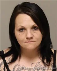 Mugshot of AMBER JUSTINE KETCHMARK booked in Anoka County, Minnesota on March 22, 2026