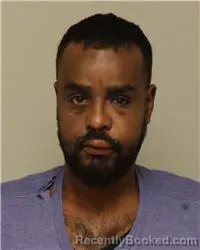 Mugshot of MOHAMED OMAR HUSSEIN booked in Anoka County, Minnesota on March 24, 2026