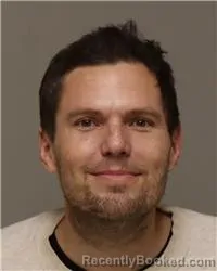 Mugshot of KRIS UNO KUENZLI booked in Anoka County, Minnesota on April 1, 2026