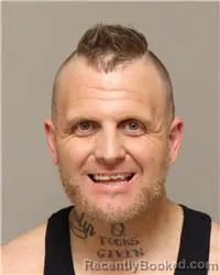 Mugshot of JUSTIN RANDALL ROBINSON booked in Anoka County, Minnesota on April 30, 2026