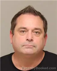 Mugshot of TRAVIS LYNN OLSON booked in Anoka County, Minnesota on May 22, 2026