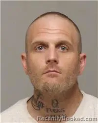 Mugshot of JUSTIN RANDALL ROBINSON booked in Anoka County, Minnesota on June 24, 2026